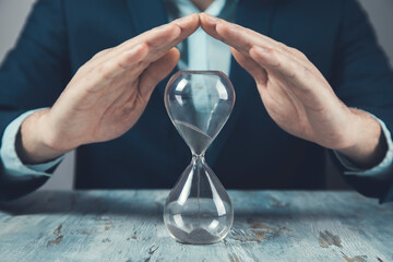 young business man with hourglass