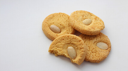 Round whole and half oatmeal cookies with nuts isolated on white background. Sweet cookies. Bakery products. Place for text. Top view. Homemade oatmeal cookies group, selective focus