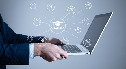 man holding computer and "E learning"
