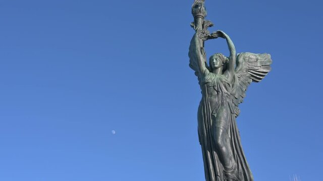 Turin, Piedmont, Italy. January 2020. Tilt footage on the Vittoria lighthouse, is a bronze statue, placed on the top of the Parco della Rimembranza, Maddalena hill. Antennas behind him.