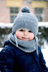 Fototapeta na wymiar winter close up outdoor portrait of adorable dreamy baby