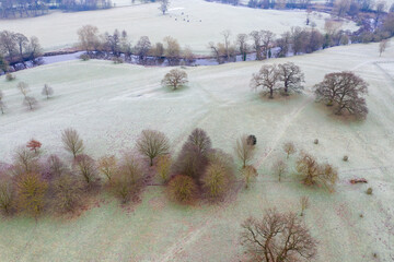 Aerial photo of the British country side taken on a cold winters frosty morning showing an aerial view of the cold British scenic rural area in the UK village of Wetherby in West Yorkshire
