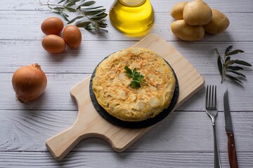 Traditional spanish omelette on wooden table