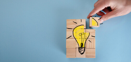 The concept of creative innovative ideas on wooden blocks