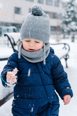 winter close up outdoor portrait of adorable dreamy baby
