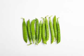 green pea pod, green peas, white background