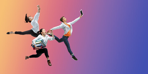 Fototapeta na wymiar Purple. Happy office workers jumping and dancing in casual clothes or suit isolated on gradient neon fluid background. Business, start-up, working open-space, motion, action concept. Creative collage.
