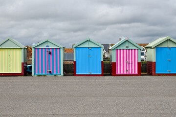 A line of beach huts at Brighton beach, UK