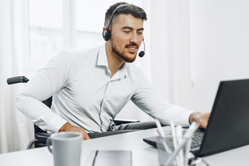 Disabled young man businessman working from home