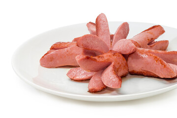 Fried vienna sausages on dish, close-up in selective focus