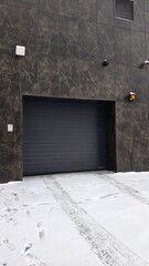 Modern new garage door in the building