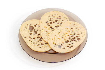 Slices of Swiss cheese on glass dish on white background