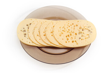 Slices of Swiss cheese on glass dish on white background