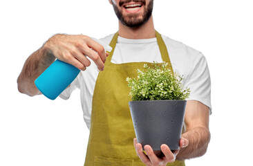 gardening, farming and people concept - close up of happy smiling male gardener or farmer in apron...