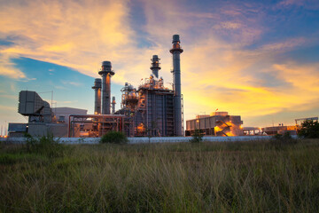 Oil refinery plant chemical factory and power plant with many storage tanks and pipelines at sunset.