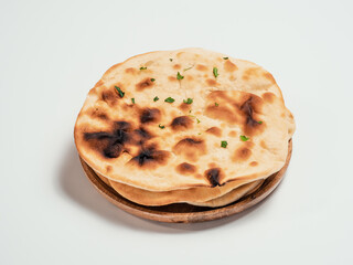 Fresh naan bread on plate isolated on white background. Stack of several perfect naan flatbreads on white.