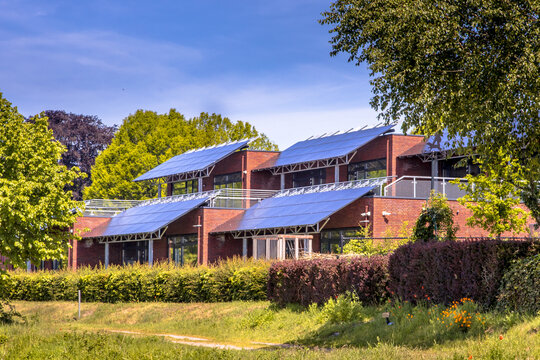 Public school building with solar panels as sun protection