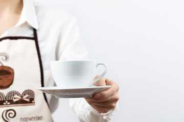 coffee time. A waiter holding and serving a glass of hot coffee, isolated in white background.
