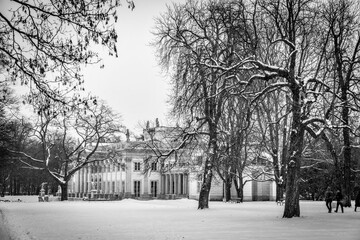 historic palace on the water in Łazienki Królewskie park in Warsaw, Poland during snowy winter