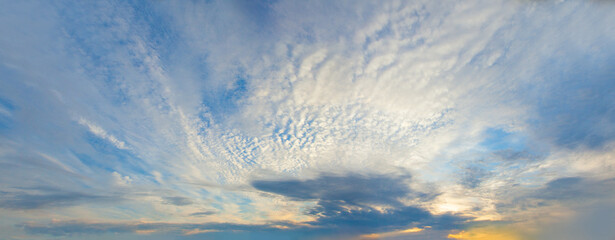 Sunset sky panorama, beautiful landscape skyline with clouds and sunlight