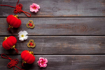 Flat lay of Chinese New Year decoration flowers and red lanterns