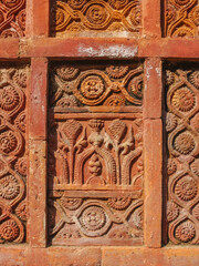 Detail of beautiful intricate terracotta carving with floral and geometric pattern on the facade of ancient Atiya or Atia mosque in Tangail district, Bangladesh