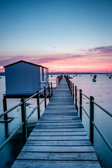 Fototapeta na wymiar Sunrise on a wooden pier, The Hardway pier, Gosport, UK