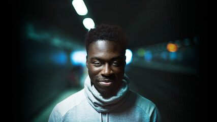 Portrait of a man at a subway platform