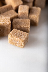 Brown sugar cubes.  Food background.