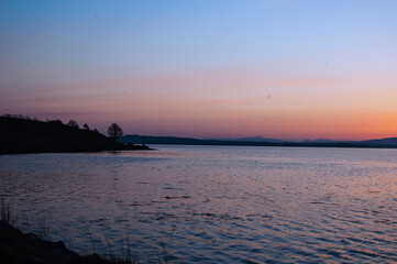 sun setting over the water in County Donegal, Ireland