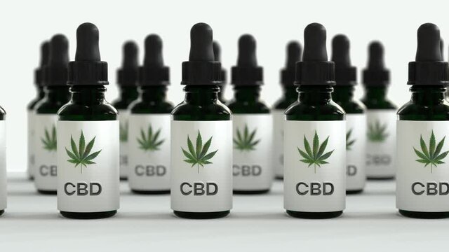 Seamless Loop of A lot of CBD oil bottles with marihuana leafs in between. White brackground
