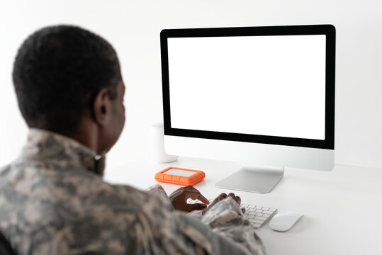 Military officer using computer army technology