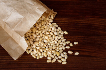 Shelled cedar pine nuts on wooden table