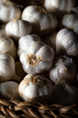 Garlic bulbs in basket. Close-up.