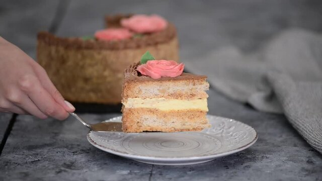 Homemade kiev cake, dacquoise cake with butter cream and hazelnuts.