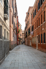 Fototapeta na wymiar wide Venetian street. street between old brick houses.