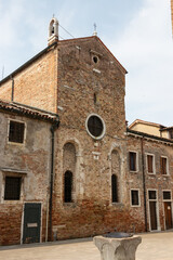 Fototapeta na wymiar facade of a medieval brick building in venice