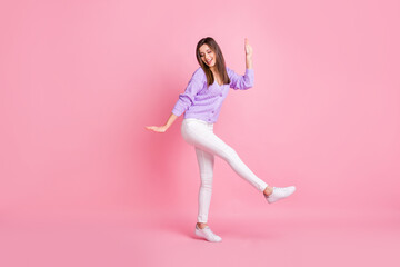 Fototapeta na wymiar Full body photo of young excited girl happy positive smile have fun dance look empty space isolated over pink color background