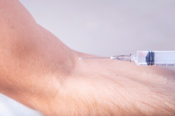 The doctor vaccinating a man. Vaccination
