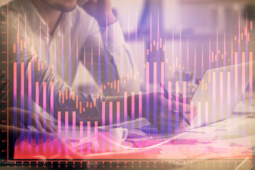 Multi exposure of man and woman working together and financial chart hologram. Business concept. Computer background.