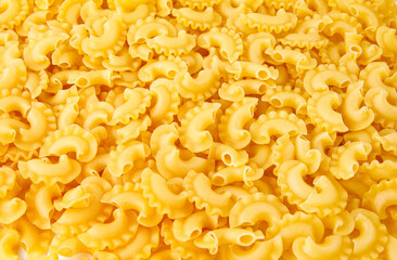 Pasta background. The pasta is filled with an even layer.