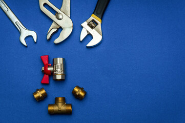 A set of tools for plumbing, isolated on blue background