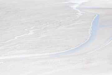 Background of amazing landscape of Atacama Desert with beige and blue salty lagoon in Chile