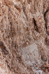 Surface of rough wall of rocky cliff located in arid Atacama Desert, Chile
