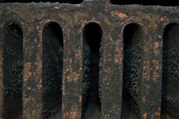 Stained unused central heating stove with soot
