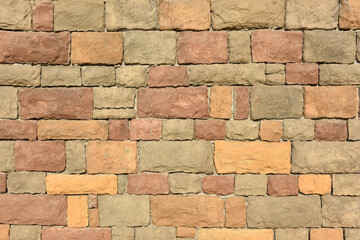 Texture background of yellow stone wall