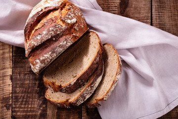 Sliced rye bread on cutting board, closeup..