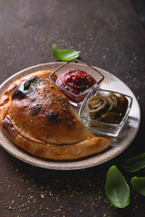 Calzone pizza with sauce and hot pepper