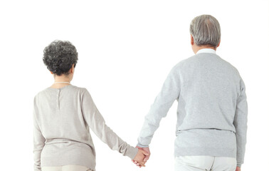 Oriental old couple holding hands