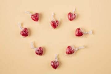 Minimal concept of hearts in the plastic bag making one large heart shape on a yellow background.